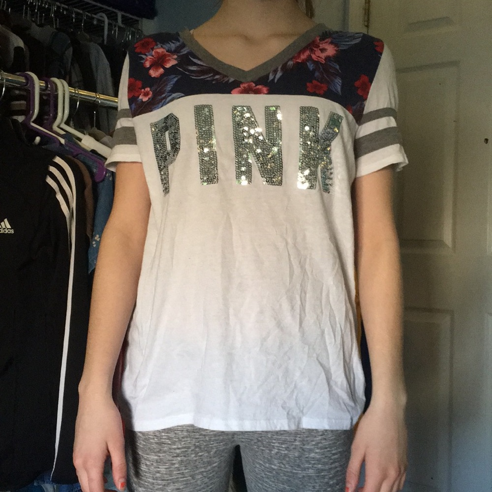 White shirt with flower designs.